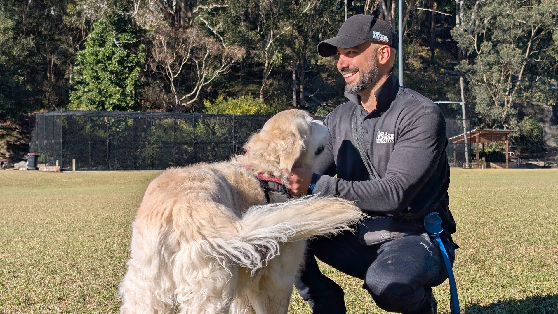 Mad Dogs franchisee stroking dog
